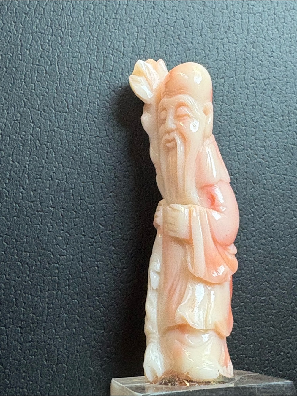 Handcrafted Coral Pink Figurine on Clear Base of traditional wise man
